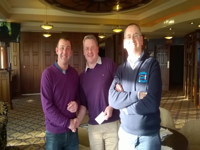 Slieve Russell winner Brian Carroll (centre). Oliver Henry event sponsor presenting with Capt. David Dolan.